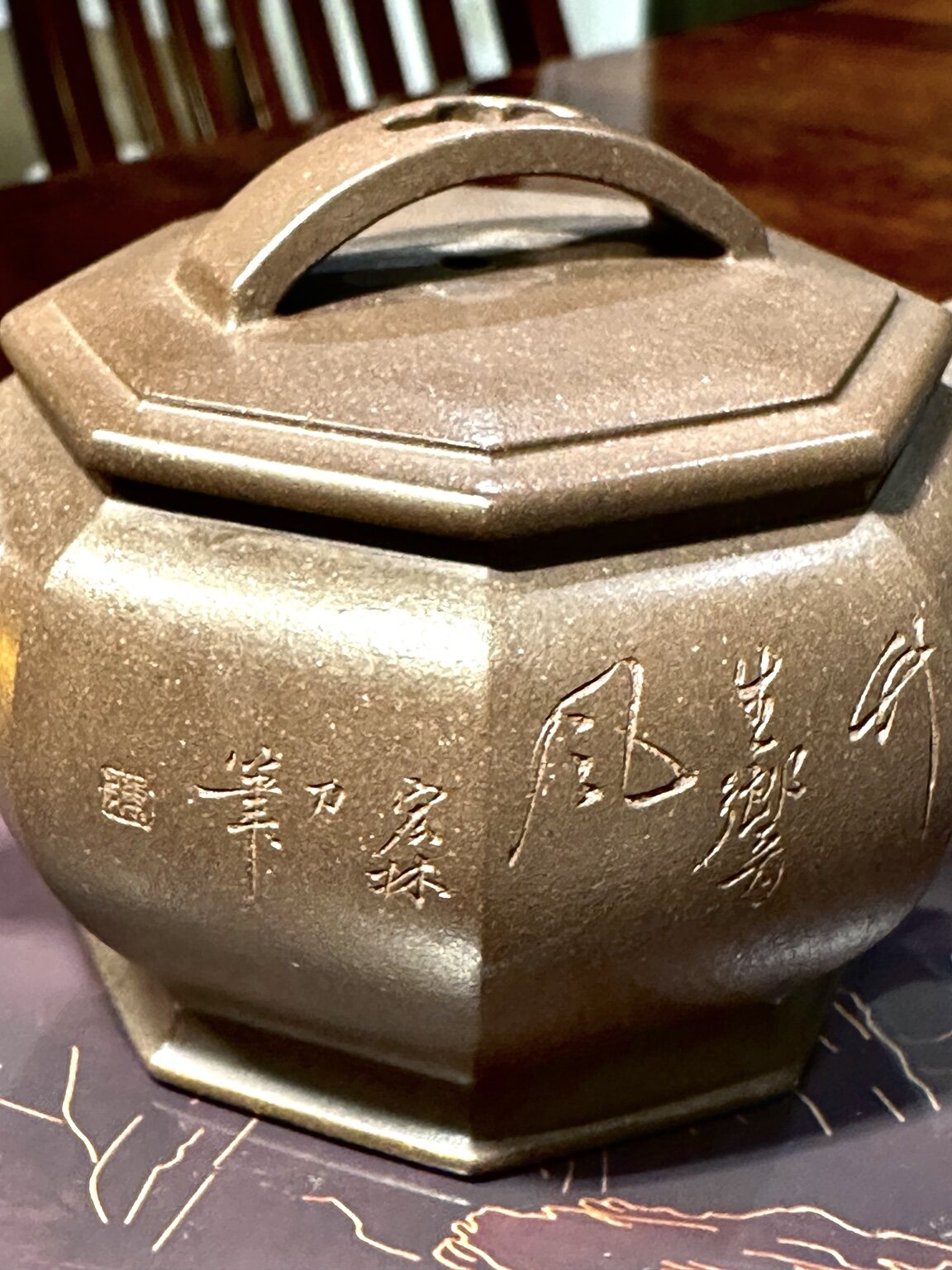 Carved inscription on the teapot